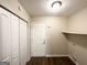 Hallway with vinyl floors, storage closet, and access to laundry connections at 3865 Lehigh Blvd, Decatur, GA 30034