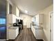 Updated kitchen with stainless steel appliances, white cabinets, and granite countertops at 3865 Lehigh Blvd, Decatur, GA 30034