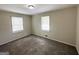 Bedroom featuring neutral walls and carpet with natural light from two windows at 4140 Pierce Rd, South Fulton, GA 30349