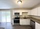 Modern kitchen with white cabinets, stainless steel appliances, and granite countertops at 4140 Pierce Rd, South Fulton, GA 30349