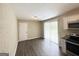 Eat-in kitchen with white cabinets, stainless appliances, and sliding glass door to backyard at 4140 Pierce Rd, South Fulton, GA 30349