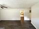 Spacious living room with modern ceiling fan and view into the kitchen at 4140 Pierce Rd, South Fulton, GA 30349