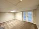 The finished basement has carpeting, a drop ceiling and access to the backyard at 4505 Wonder Valley Trl, Decatur, GA 30034