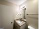 Well-lit bathroom with granite countertop vanity, mirror and towel rack at 4505 Wonder Valley Trl, Decatur, GA 30034