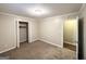 This bedroom features a standard closet and a door to the rest of the house at 4505 Wonder Valley Trl, Decatur, GA 30034