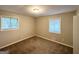 This bedroom features two windows to let light in, neutral walls, and carpeting at 4505 Wonder Valley Trl, Decatur, GA 30034
