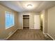 This bedroom features a window and a closet for storage at 4505 Wonder Valley Trl, Decatur, GA 30034
