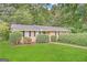 Charming ranch home with lush green lawn and mature trees offering great curb appeal at 4505 Wonder Valley Trl, Decatur, GA 30034