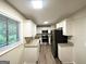 Renovated kitchen featuring granite counters, stainless steel appliances, and ample cabinet space at 4505 Wonder Valley Trl, Decatur, GA 30034