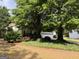Charming single-story home with mature trees and landscaping, offering a serene and private setting at 3041 Regal Dr, Mcdonough, GA 30253