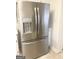 Stainless steel refrigerator in kitchen with water and ice dispenser at 3041 Regal Dr, Mcdonough, GA 30253