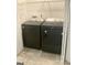 Laundry room includes black Maytag washer and dryer at 3041 Regal Dr, Mcdonough, GA 30253