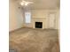 Spacious living room features neutral carpet, a white fireplace, and ample space for relaxing and entertaining at 3041 Regal Dr, Mcdonough, GA 30253