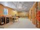 Unfinished basement with workbench, window, and exposed ceiling at 125 Anna Dr, Covington, GA 30014