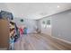 Finished basement with neutral walls, vinyl floors, and walkout to backyard at 125 Anna Dr, Covington, GA 30014