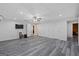 Finished basement with drop ceiling, entertainment area, and multiple doors at 125 Anna Dr, Covington, GA 30014