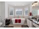 Bright bathroom features a soaking tub with neutral tile accents and a double vanity with dark countertops at 125 Anna Dr, Covington, GA 30014