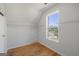 This room features hardwood floors, a closet, a window with a view, and white walls at 125 Anna Dr, Covington, GA 30014