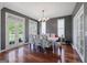 Spacious dining room with hardwood floors, a chandelier, and a large table, perfect for Gathering dinners and celebrations at 125 Anna Dr, Covington, GA 30014