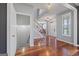 Bright foyer with hardwood floors, staircase, and natural light at 125 Anna Dr, Covington, GA 30014
