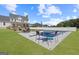 Backyard with an in-ground pool, patio area with furniture, and a white fence at 125 Anna Dr, Covington, GA 30014