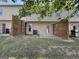 View of a backyard with a wood fence and concrete patio, plus a lawn with patchy grass at 1853 Broad River Rd, Atlanta, GA 30349