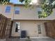 Backyard featuring a fence, an AC unit, and a door at 1853 Broad River Rd, Atlanta, GA 30349