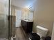 A bathroom features dual sinks, a shower, and a toilet at 1853 Broad River Rd, Atlanta, GA 30349