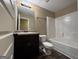 Bathroom featuring a vanity with a sink and a shower with a tub at 1853 Broad River Rd, Atlanta, GA 30349