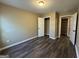 A cozy bedroom with two closets and vinyl flooring at 1853 Broad River Rd, Atlanta, GA 30349