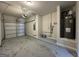 Spacious garage with a water heater, storage space, and a working garage door at 1853 Broad River Rd, Atlanta, GA 30349