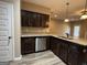 Kitchen featuring dark cabinets, granite countertops, and stainless steel appliances at 1853 Broad River Rd, Atlanta, GA 30349