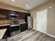 Kitchen featuring stainless steel appliances and dark cabinetry at 1853 Broad River Rd, Atlanta, GA 30349