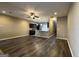 Spacious living room with hardwood floors, neutral paint, and an open floor plan to the kitchen at 1853 Broad River Rd, Atlanta, GA 30349