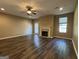 Bright living room featuring a fireplace, ceiling fan, recessed lighting, and a sliding glass door at 1853 Broad River Rd, Atlanta, GA 30349