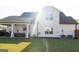 Large backyard with a covered patio and exterior view of the home with a large, grassy area at 15 Dayton Way, Sharpsburg, GA 30277