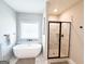 Elegant bathroom featuring a freestanding tub and a separate shower, offering a luxurious spa-like experience at 15 Dayton Way, Sharpsburg, GA 30277