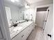 Modern bathroom with double sinks, granite countertops, and white cabinetry provides ample space and style at 15 Dayton Way, Sharpsburg, GA 30277
