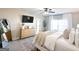 Relaxing bedroom showcasing a comfortable bed, stylish dresser, accent mirror, and serene decor at 15 Dayton Way, Sharpsburg, GA 30277