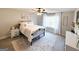 Comfortable bedroom featuring a stylish wrought iron bed frame, neutral color palette, and bright natural light at 15 Dayton Way, Sharpsburg, GA 30277