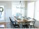 Bright dining area featuring natural light, stylish decor, and seating for eight at 15 Dayton Way, Sharpsburg, GA 30277