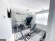 A home gym with weightlifting equipment, a TV, and a window providing ample natural light at 15 Dayton Way, Sharpsburg, GA 30277
