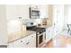 Well-equipped kitchen with granite countertops and stainless steel gas range at 15 Dayton Way, Sharpsburg, GA 30277