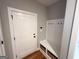 Functional mudroom area with built-in bench and storage baskets to help keep the entryway tidy and organized at 15 Dayton Way, Sharpsburg, GA 30277