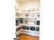 Well-organized pantry with granite countertops, modern appliances, and ample storage space for food and kitchen essentials at 15 Dayton Way, Sharpsburg, GA 30277