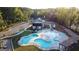 Overhead view of the pool, clubhouse, lounge chairs, and surrounding greenery creating a peaceful atmosphere at 15 Dayton Way, Sharpsburg, GA 30277