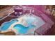 Stunning community pool featuring crystal clear water, a pergola with seating, and comfortable lounge chairs at 15 Dayton Way, Sharpsburg, GA 30277