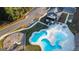 Aerial view of the neighborhood pool area with a playground, and a parking lot for easy access at 15 Dayton Way, Sharpsburg, GA 30277