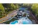 Aerial shot displaying the pool, community clubhouse, and the beautifully maintained tennis courts at 15 Dayton Way, Sharpsburg, GA 30277