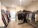 Spacious walk-in closet providing ample storage with organized shelving and hanging space for clothes and accessories at 15 Dayton Way, Sharpsburg, GA 30277